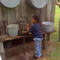 Student Using a Pump at Fort Christmas