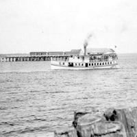 Steamboat &#039;Clara&#039; Sailing Past a Dock on Lake Monroe