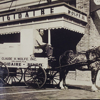 Claude H. Wolfe, Inc. Buggy in Front of the Frigidaire Store