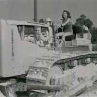 Geanie L.W. Brooks in Weeki Wachee Springs Mermaid Uniform Operating a Caterpillar D-7 Bulldozer