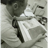 Apollo 11 Astronaut Buzz Aldrin Examining Lunar Surface Photographs